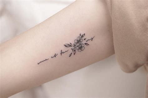 flowers with writing tattoo